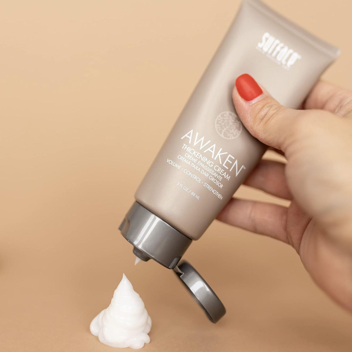 SURFACE being applied to damp hair for added volume benefit