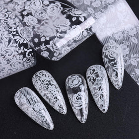 SUTOKAKA white floral foil on tip demonstrating delicate, vintage-style nail art