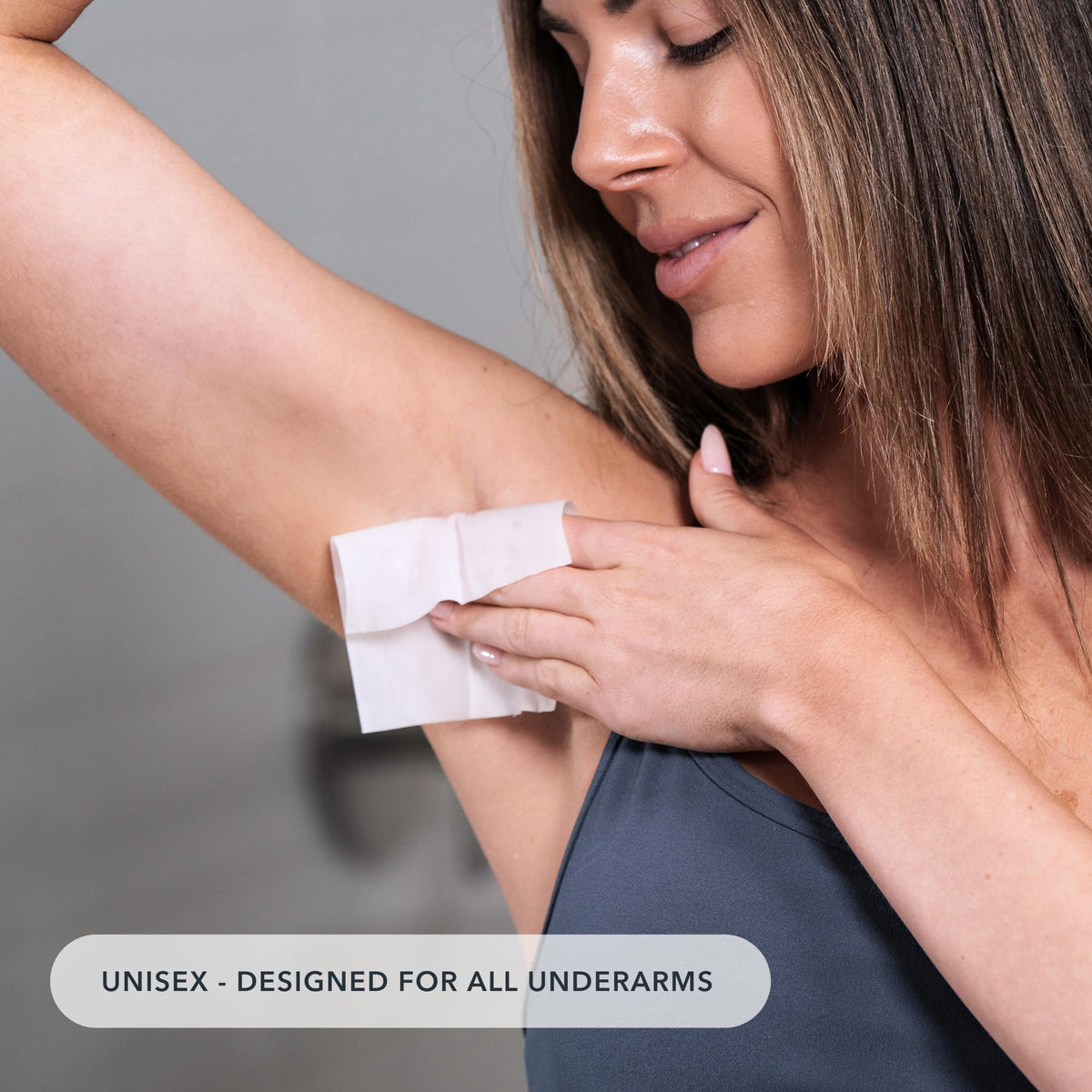 Applying a SweatBlock wipe to underarm demonstrating overnight application benefit