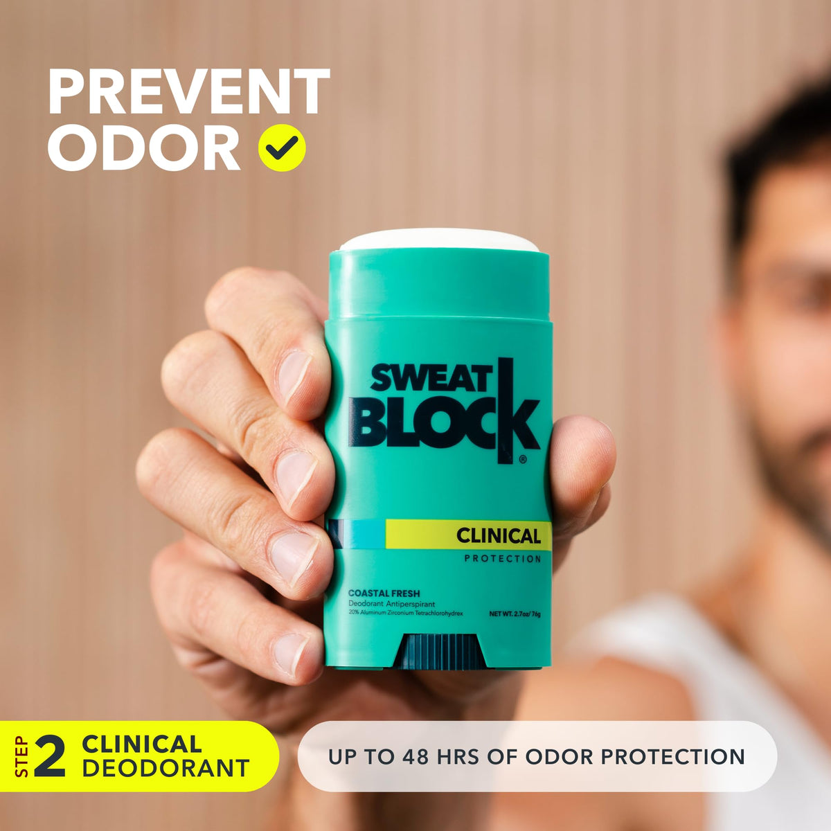 Hand holding SweatBlock deodorant stick illustrating easy daily application