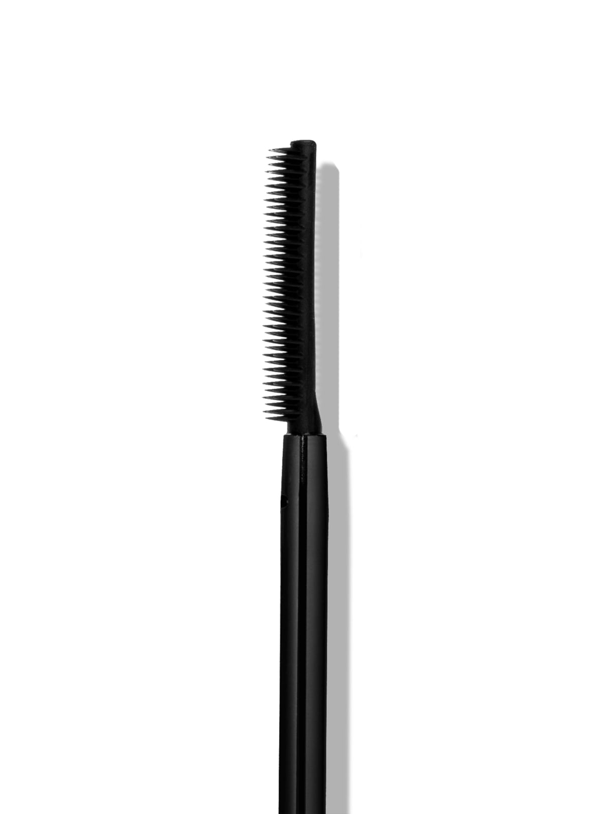 SWEED mascara held in hand showing compact 8 ml travel-friendly size