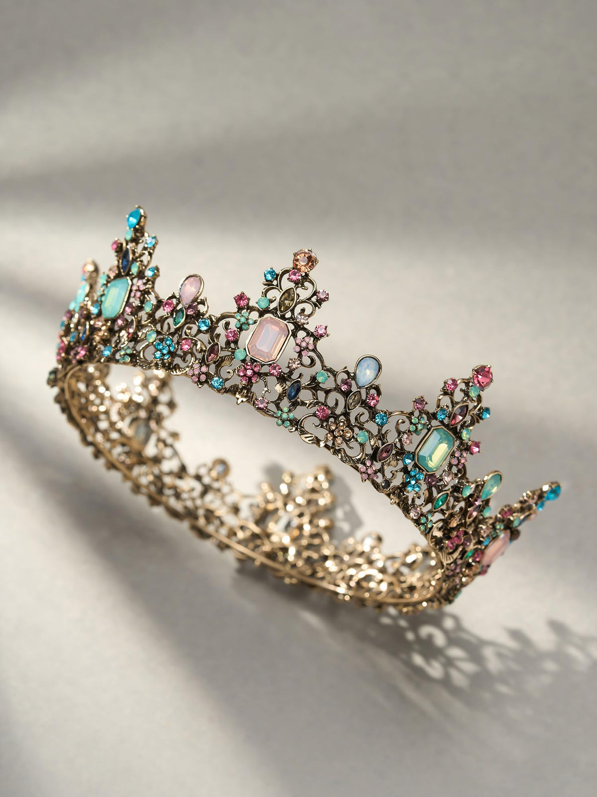 SWEETV crown beside a ruler showing approximate 2.3-inch height and scale