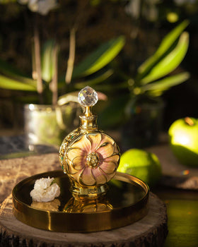 Swiss Arabian Amaali oil drop on skin texture showing rich, long-lasting concentration