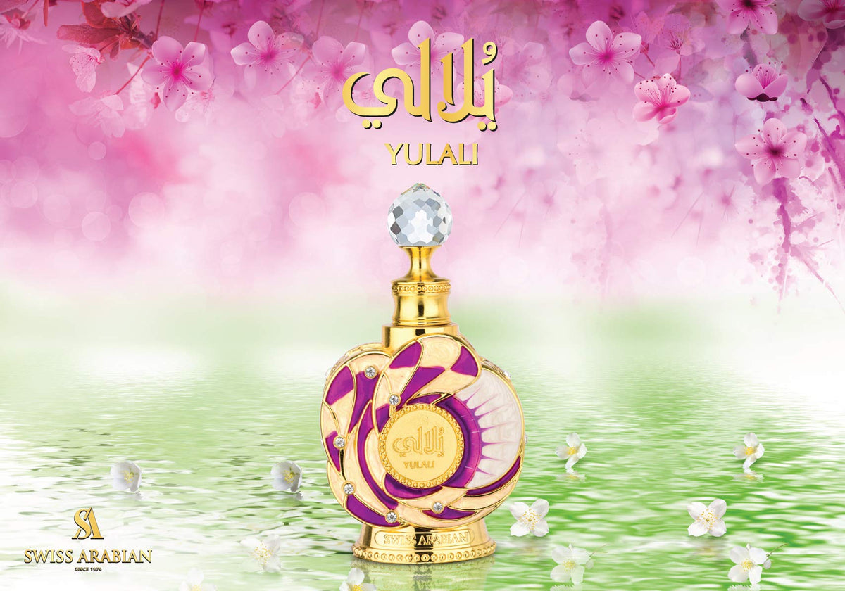 Swiss Arabian Yulali 0.5 oz bottle next to a coin illustrating compact travel-friendly size