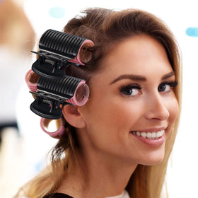 Syhood clips in a bathroom styling scene holding rollers, showing convenient at-home use