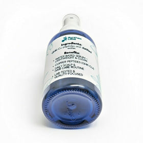 SYNTHEX LABS bottle in hand for scale to show compact travel-friendly convenience