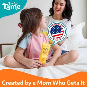 T is for Tame size comparison in adult hand for travel-friendly convenience