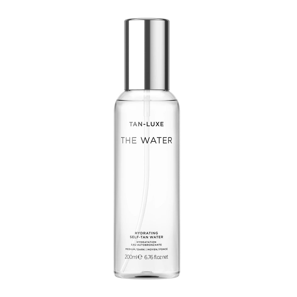 TAN-LUXE front bottle view showing sleek packaging and clear tanning water benefits