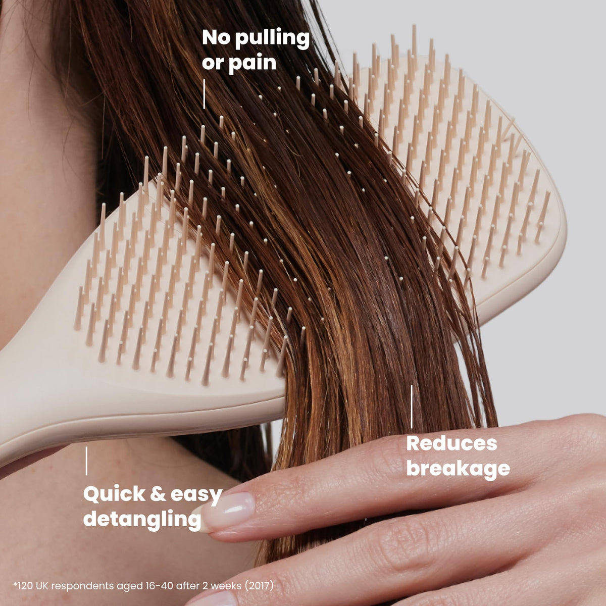 TANGLE TEEZER brush in hand demonstrating large paddle coverage