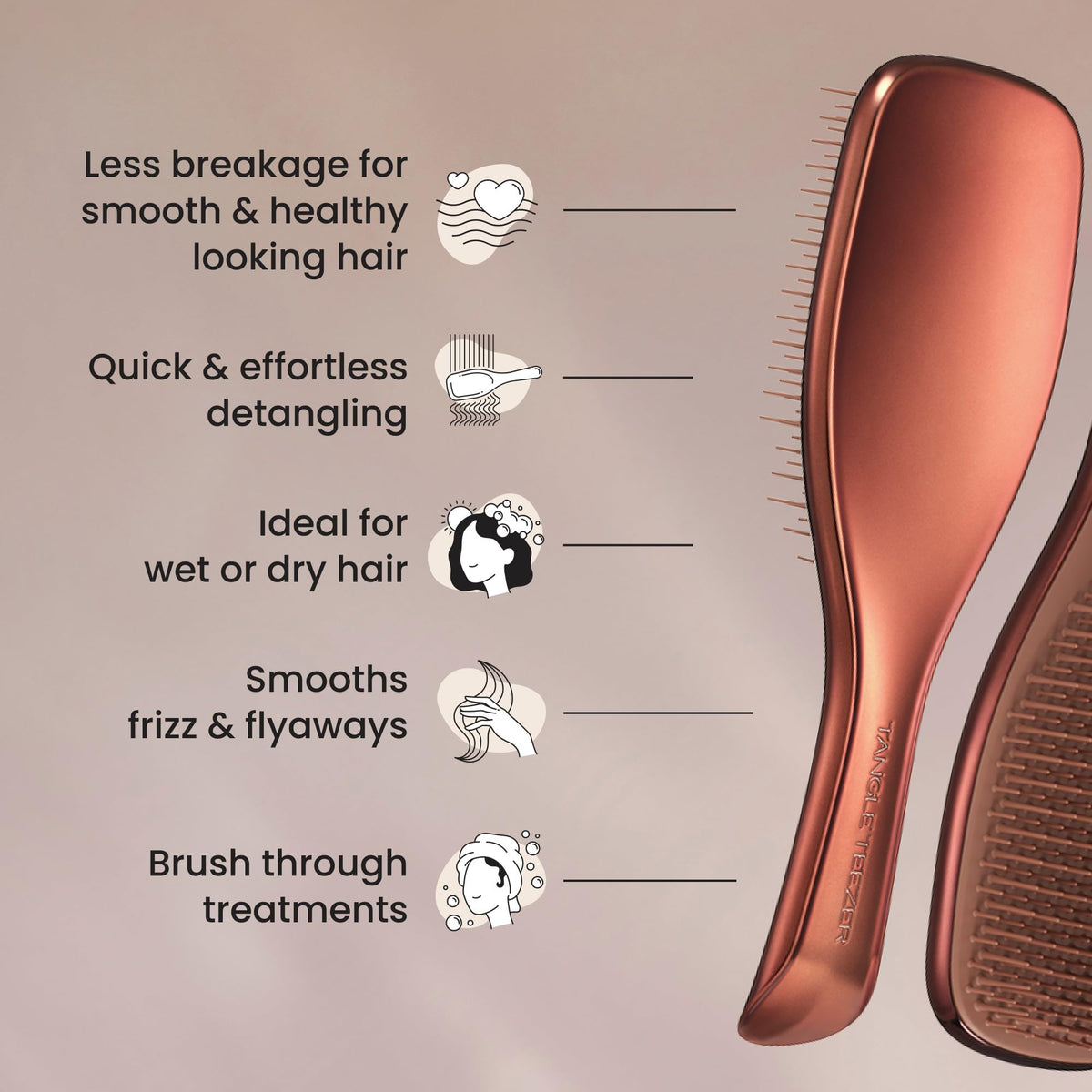 TANGLE TEEZER in hand for scale showing compact travel-friendly size