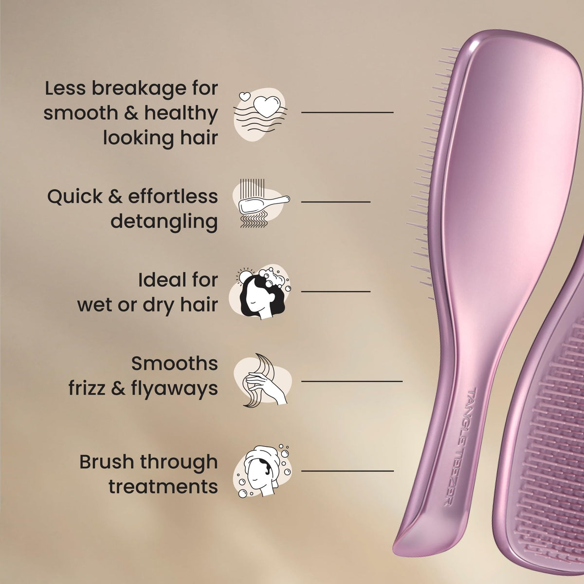 TANGLE TEEZER next to hand for scale showing compact size benefit: travel-friendly