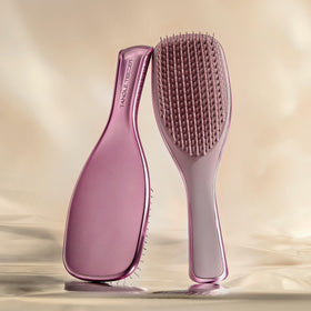 TANGLE TEEZER close-up of two-tiered teeth showing detangling action benefit: gentle knot removal