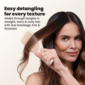 TANGLE TEEZER spreading conditioner through wet hair for smoother strands