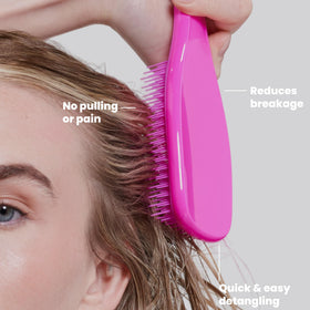 TANGLE TEEZER held in hand to show scale and comfortable control for delicate hair
