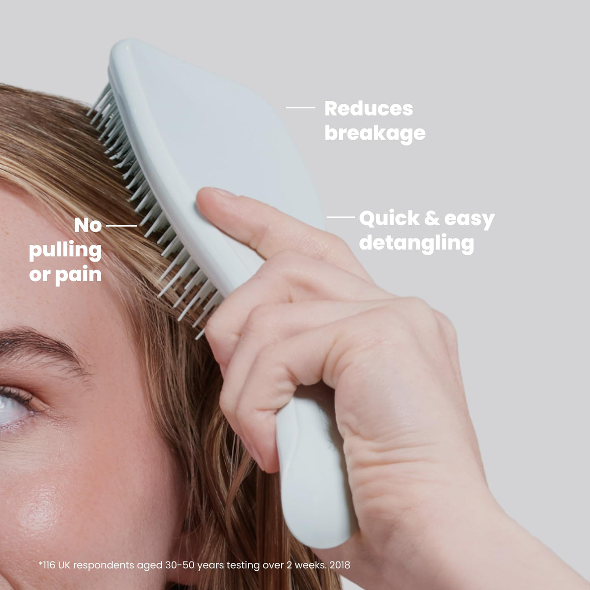 TANGLE TEEZER in hand to show large brush scale, faster detangling