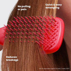TANGLE TEEZER held in hand illustrating travel-size convenience and easy handling benefit