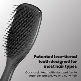 TANGLE TEEZER paddle compared to hand to show larger 20% wider surface for faster coverage