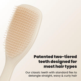 TANGLE TEEZER back paddle detail displaying ergonomic grip comfort