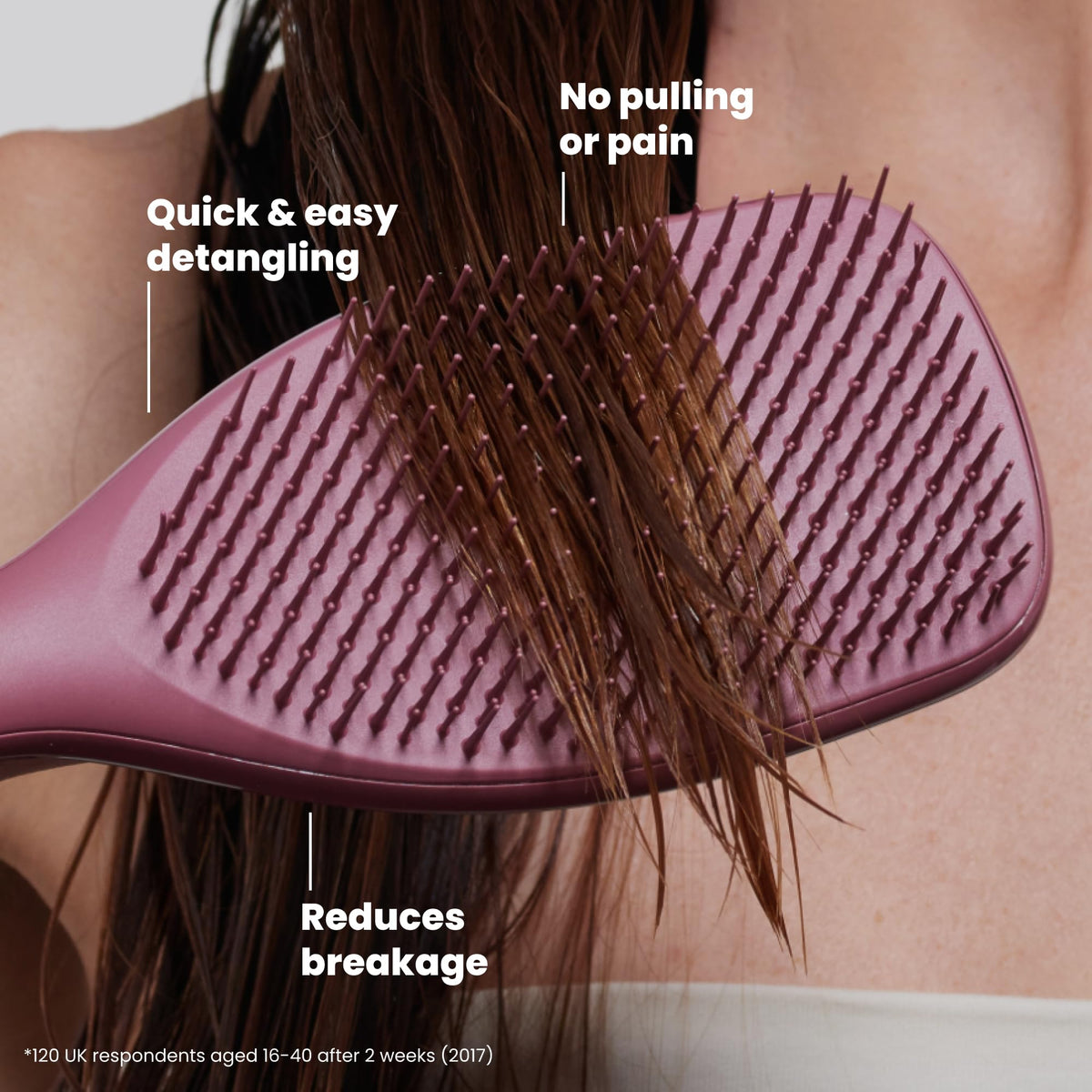 TANGLE TEEZER held in hand to show size and control for faster detangling