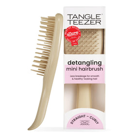 TANGLE TEEZER mini front view showing oat cream compact design and easy portability