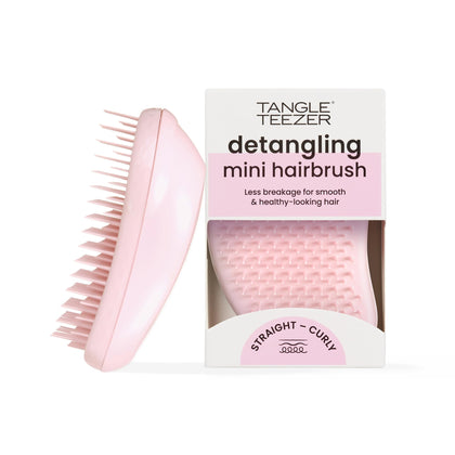 TANGLE TEEZER mini front view showing compact size and bright millennial pink finish, easy to pack