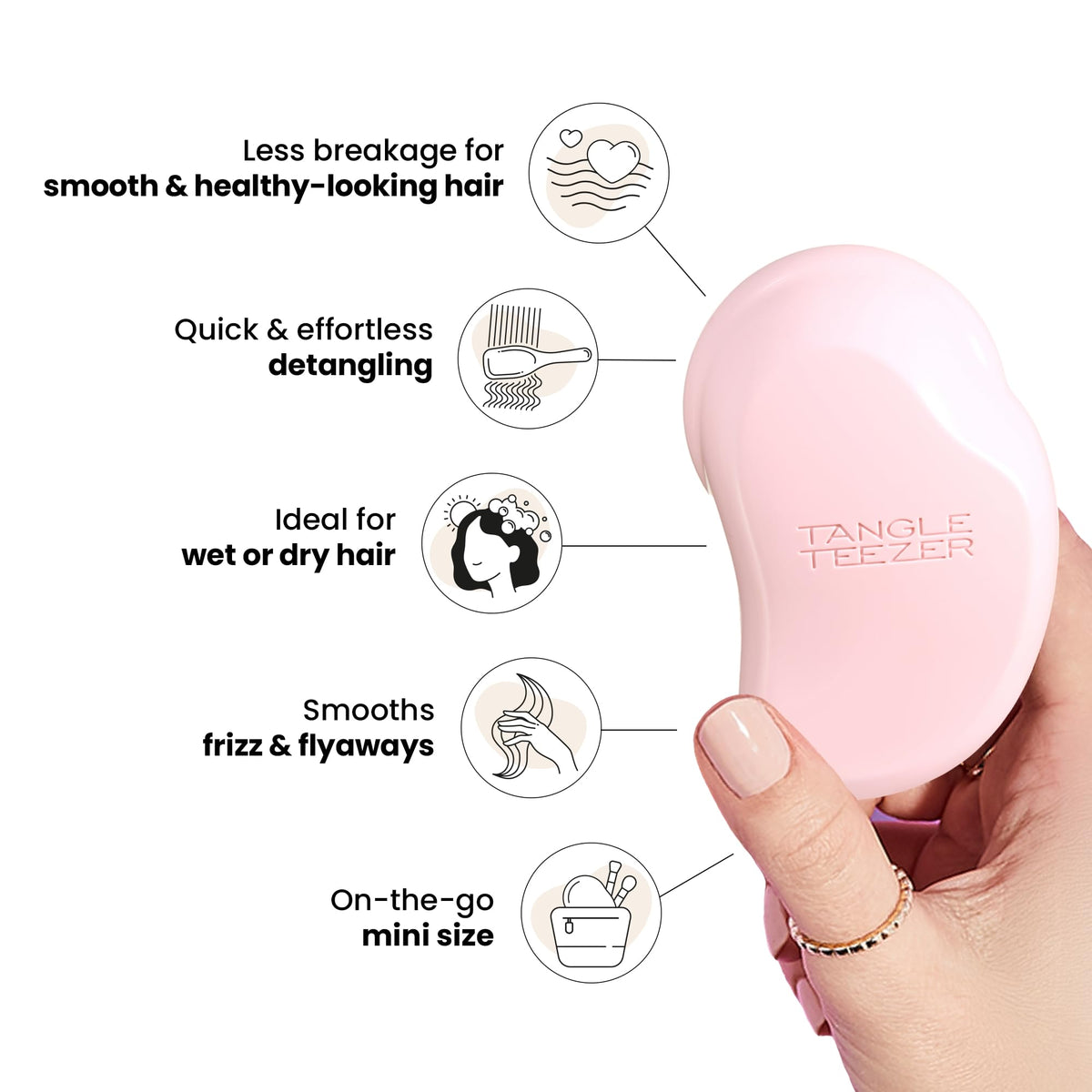 TANGLE TEEZER held by a child demonstrating small-hand friendly design and easy brushing