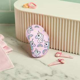 TANGLE TEEZER next to travel pouch ready for on-the-go use