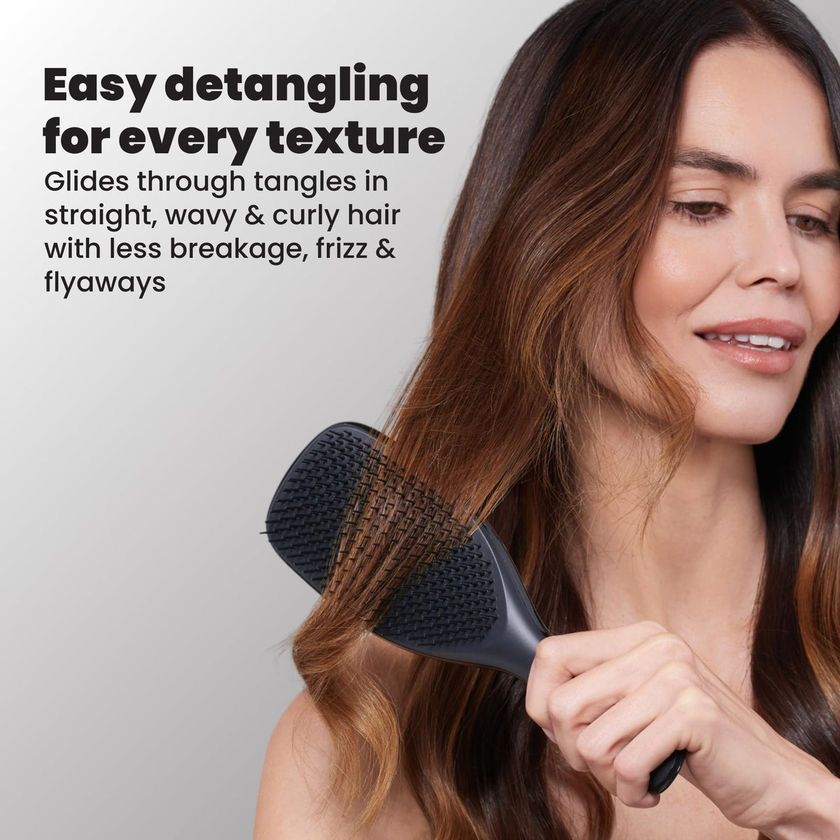 TANGLE TEEZER teeth meeting scalp to show regular-flex design that reduces tugging