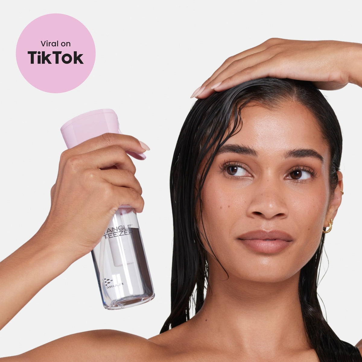 TANGLE TEEZER next to toiletries shows 6.1 oz scale and portability benefit