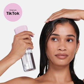 TANGLE TEEZER next to toiletries shows 6.1 oz scale and portability benefit