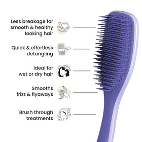 TANGLE TEEZER in shower spreading conditioner evenly to illustrate product distribution benefits