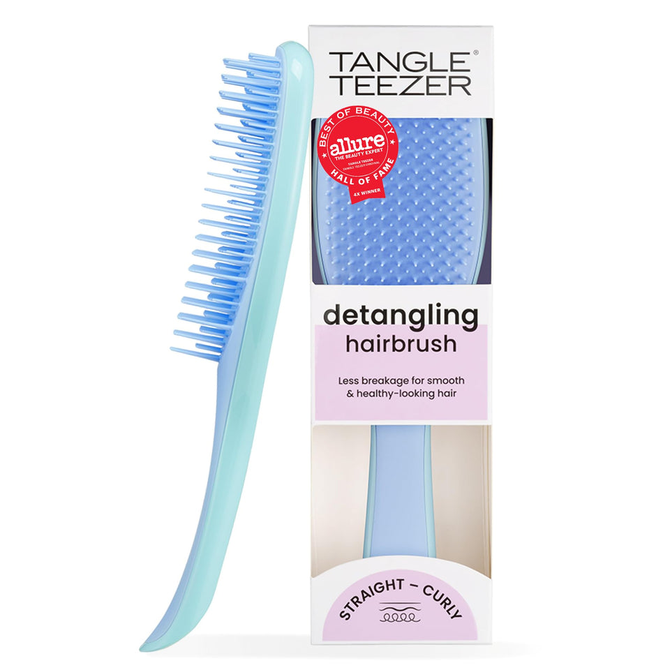 TANGLE TEEZER front view showing denim blues finish and ergonomic grip benefit