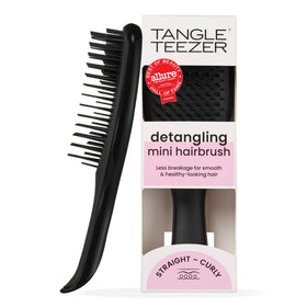TANGLE TEEZER front view of black Ultimate Detangler showing compact shape and portability