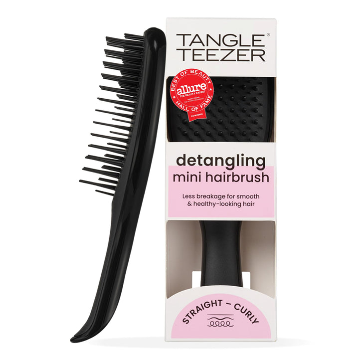 TANGLE TEEZER front view of black Ultimate Detangler showing compact shape and portability