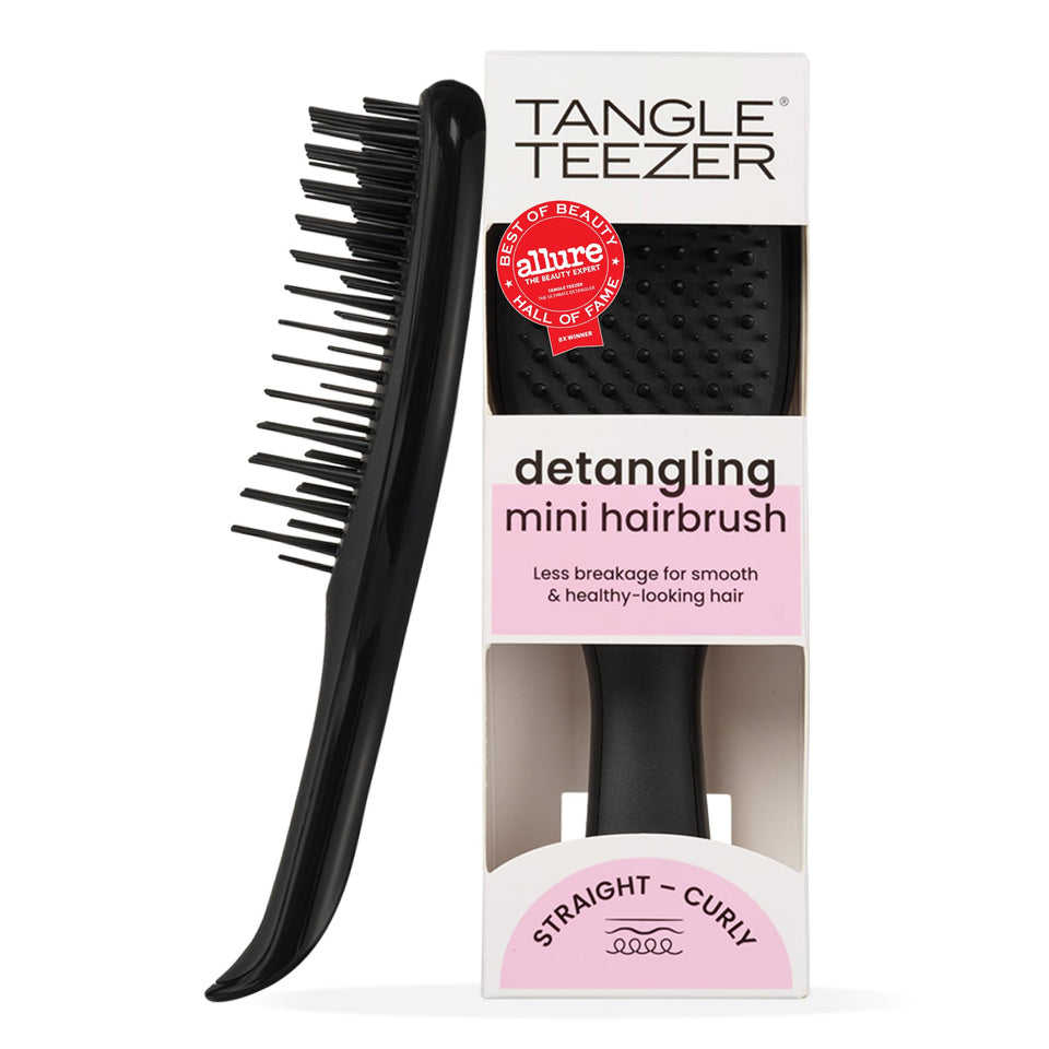 TANGLE TEEZER front view of black Ultimate Detangler showing compact shape and portability