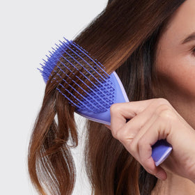 TANGLE TEEZER brush next to eco-friendly packaging to highlight brand's sustainable transition