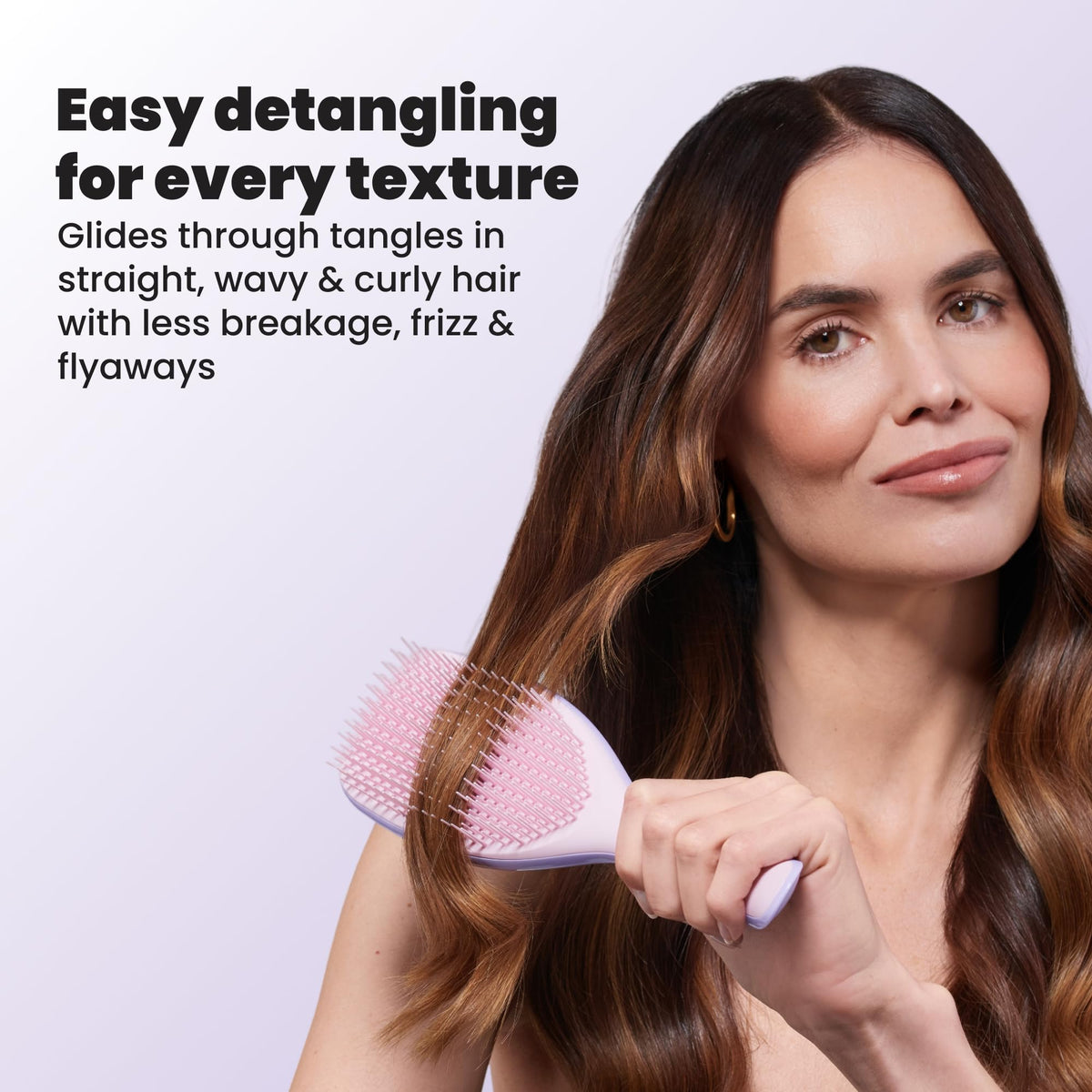 TANGLE TEEZER beside standard brush to show 20% larger paddle for broader coverage