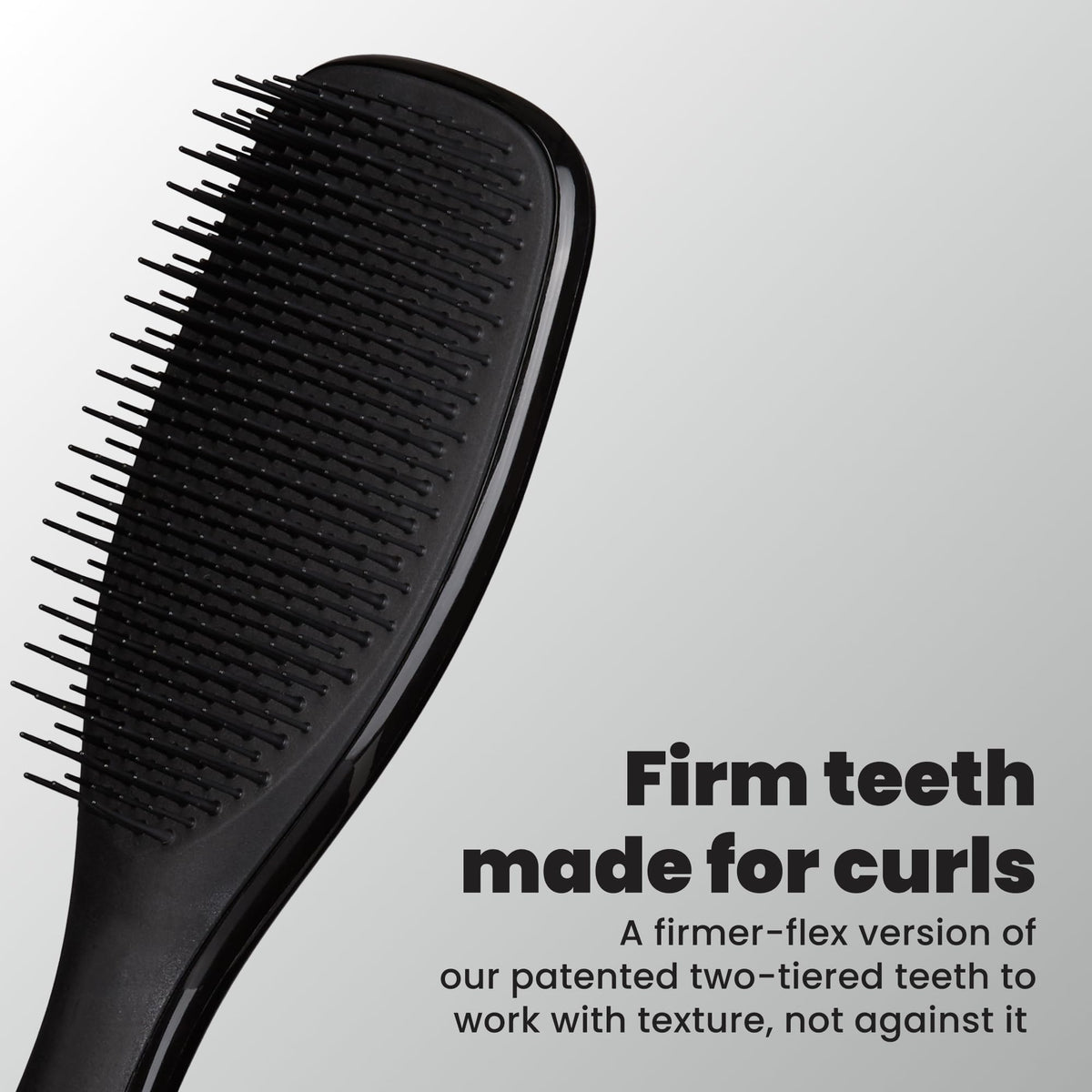 TANGLE TEEZER close-up of two-tiered teeth showing firmer detangling action benefit