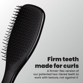 TANGLE TEEZER close-up of two-tiered teeth showing firmer detangling action benefit
