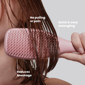 TANGLE TEEZER in use on wet hair in shower demonstrating conditioner-friendly design