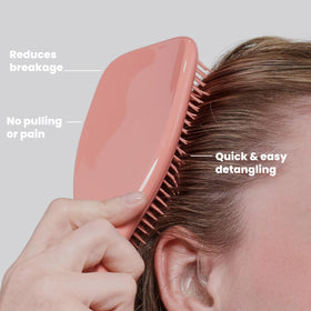 TANGLE TEEZER brushing wet hair in shower to distribute conditioner evenly and detangle