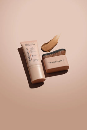 Tanologist brush contouring cheek to define and sculpt features
