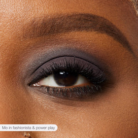 tarte applying shade with brush on eyelid for precise crease definition