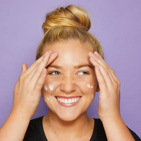 tarte primer spread on hand, showing smoothing effect and quick absorption benefit