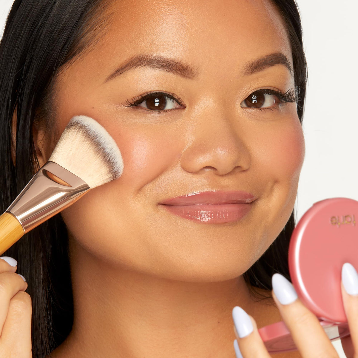 tarte blush applied on cheeks lifestyle image showing natural, airbrushed radiance
