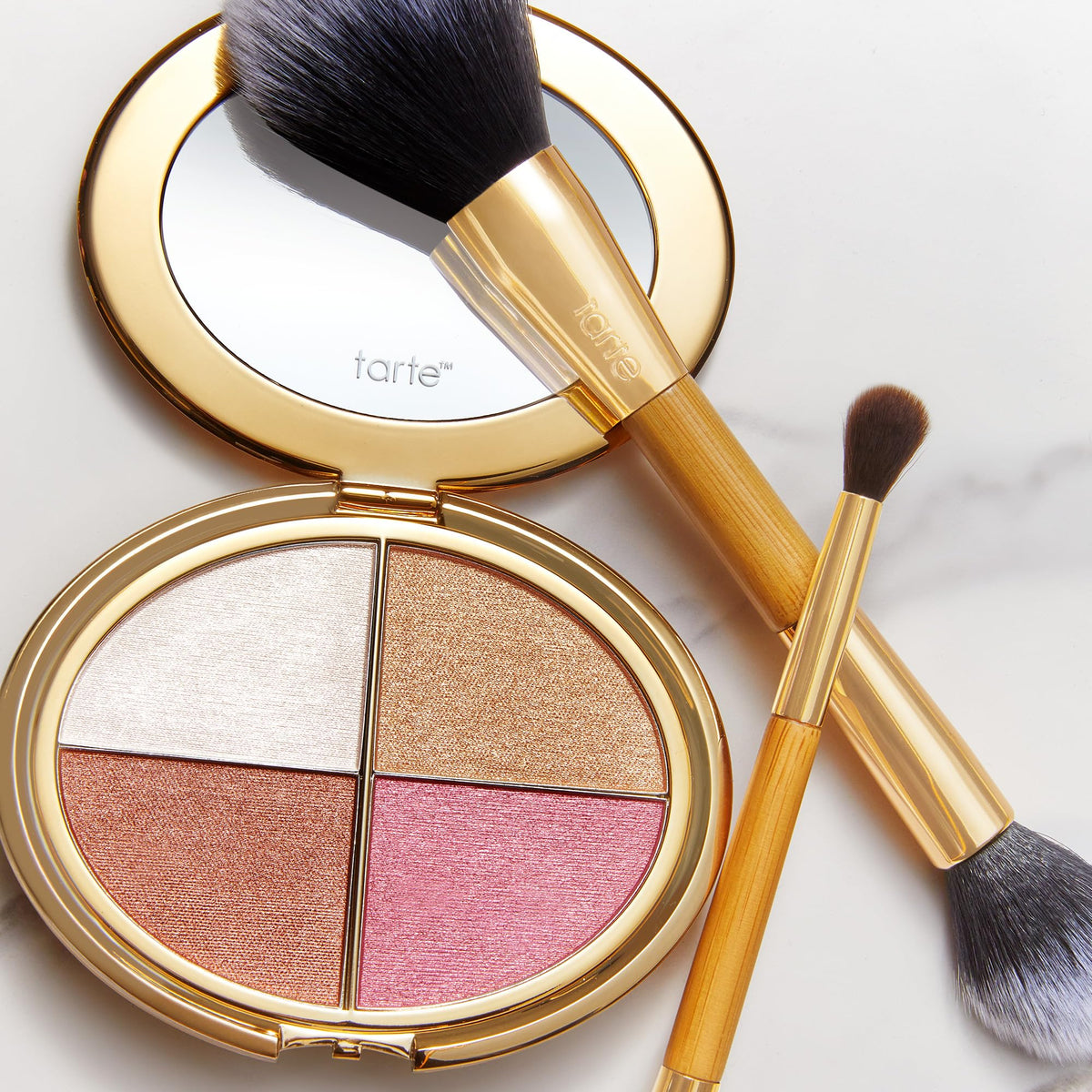 tarte size comparison with hand illustrating compact portability for travel