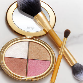 tarte size comparison with hand illustrating compact portability for travel
