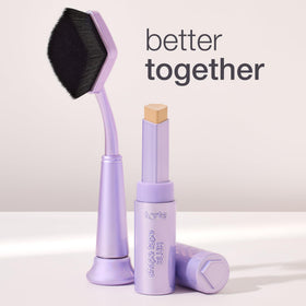 tarte brush next to concealer stick showing size and compatibility