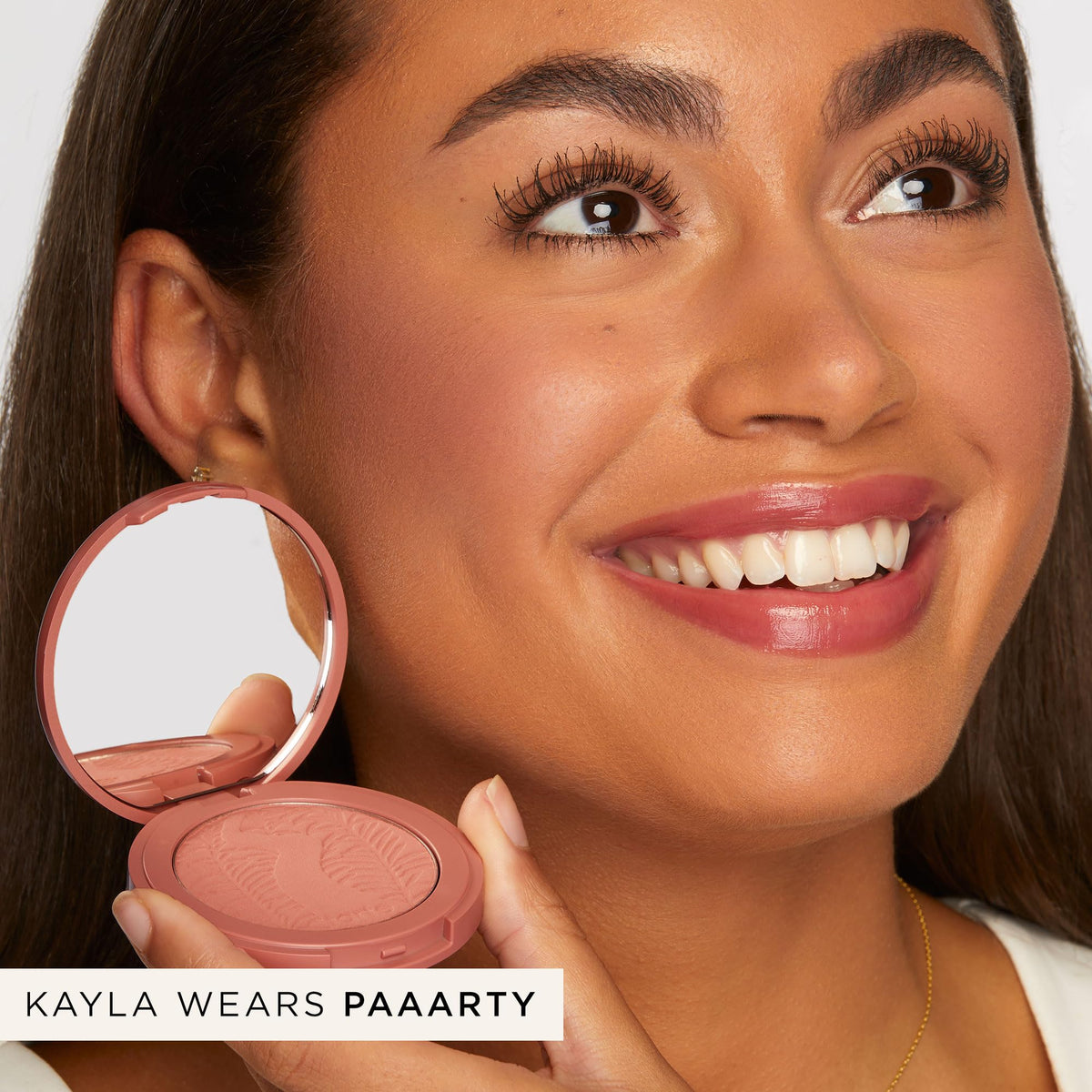 tarte swatch on arm showing payoff and buildable color for customizable intensity