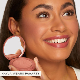 tarte swatch on arm showing payoff and buildable color for customizable intensity